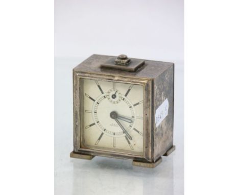 A chrome plated Art Deco French Jaz travel alarm clock, champagne dial and subsidary dial, black and white baton numerals, bl