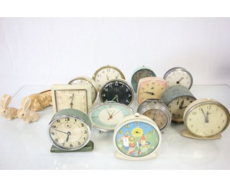 A quantity of mid 20th century alarm clocks to include Noddy a Sylvac dog planter etc.