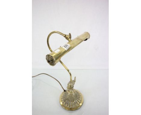 A vintage brass desk lamp.