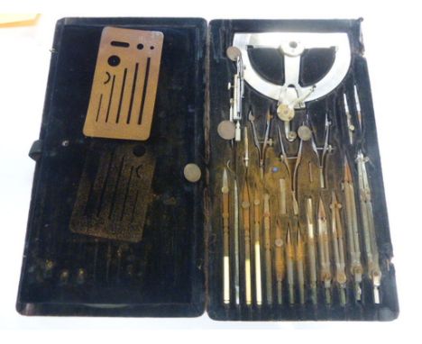 A cased architects' drawing set comprising drawing tools (af)