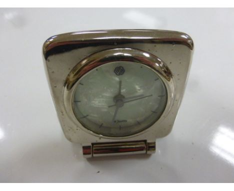 St Justin travel clock with mother of pearl face and Celtic design 