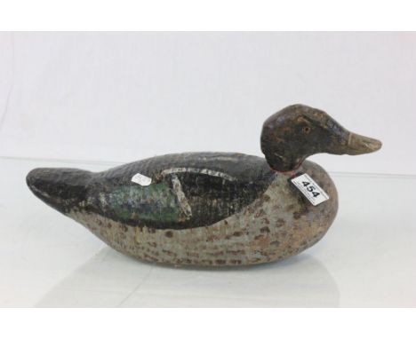 A vintage carved weighted duck decoy 