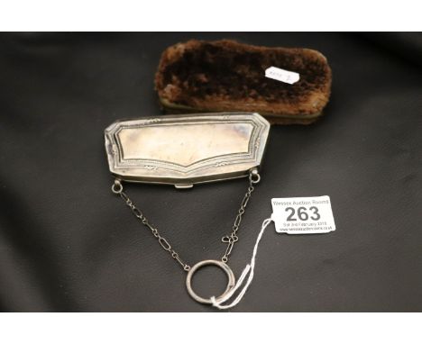 An Edwardian silver finger purse, Birmingham 1914, Samuel M Levi, faint engraved inscription, gadroon and reeded border decor