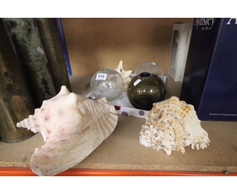 Three vintage Seashells to include Conch and three glass fishing floats