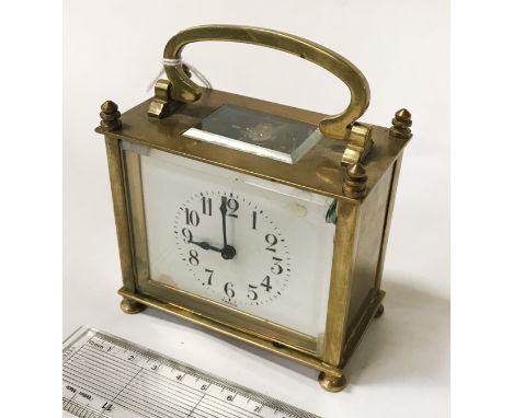 SMALL FRENCH MANTLE CLOCK IN BRASS