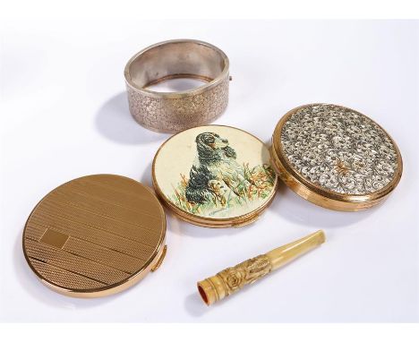 Silver bracelet/bangle, together with three compacts and a cigarette holder carved from bone (5)