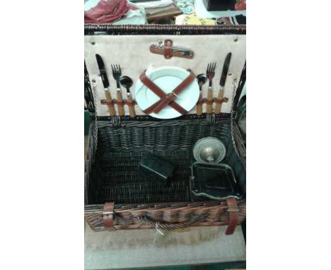 A wicker picnic basket with set consisting of plates cutlery and bottle opener for two, together with a wooden trinket box, b