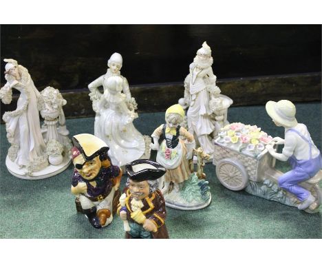 Mixed ceramic figurines to include a Staffordshire hand painted Long John Silver Toby jug and Regency fine Arts figures (qty)