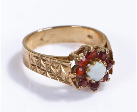 9 carat gold opal and garnet ring, with a central opal and garnet surround, ring size M