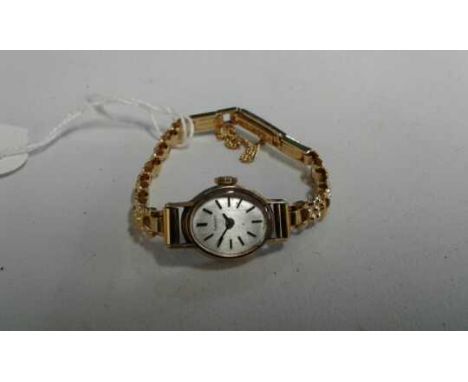 Timex 9 carat gold ladies wristwatch, with a signed silvered dial