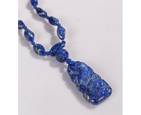 Lapis lazuli Chinese pendant necklace, carved with a bird above a scroll to the bead necklace, the pendant 47mm high