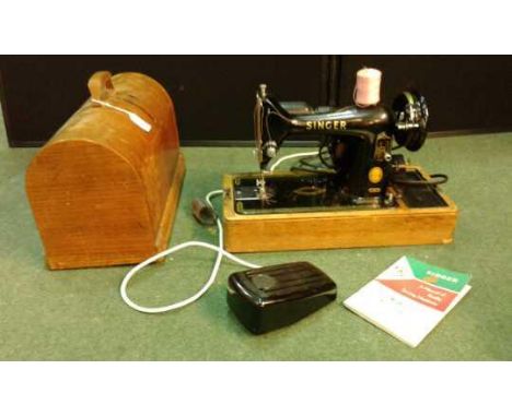 Singer electric sewing machine, cased and with manual