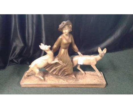 ceramic table centre piece of a lady walking with two deer, 45cm high