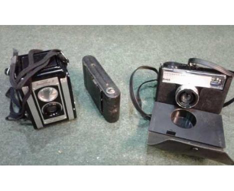 Four vintage Cameras, including a Kodak Duaflex II, a Goerz Tenax, a Kodak Instamatic 233, and a TriFCA 130, (4)