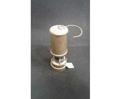 A brass ornamental Welsh miners paraffin lamp