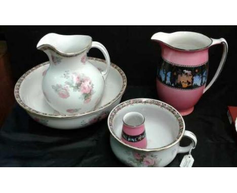 Large jug, basin and chamber pot decorated with roses also to include a large jug in pink with shilhoutte decoration and a ma