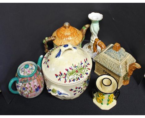Collection of tea pots, to include cottage examples, a Japanese example, a Limoges candlestick, another candlestick, (6)