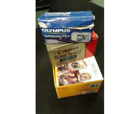 Three boxed Cameras to include an Olympus superzoom 76G, Canon Sureshot Supreme, and a Kodak DC3800 digital camera.(3)