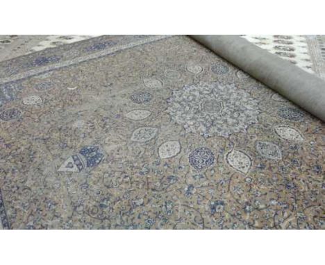 Middle Eastern carpet, the blue and cream ground with all over floral and leaf decoration, 268cm wide