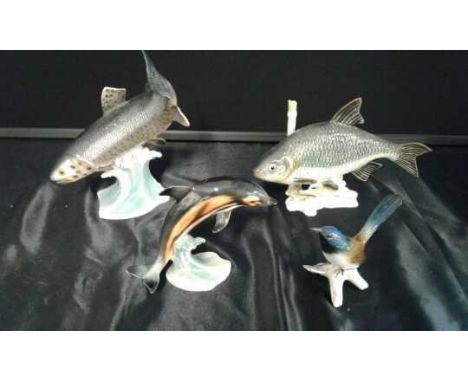 Two Goebel ceramic fish, a Goebel ceramic dolphin and a ceramic bird, (4)