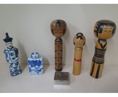 Three Japanese Kokoshi dolls, tallest 37cm, an Oriental blue and white figure, a tea caddy and a plated desk box, some wear t