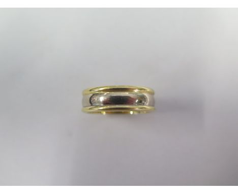 A hallmarked 18ct yellow and white gold ring, size U, approx 11.1 grams, in generally good condition 