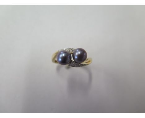 A yellow gold black pearl ring, no hallmark but tests to approx 9ct, ring size P, approx 3.3 grams, in good condition 