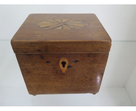 A Georgian mahogany inlaid tea caddy, 12cm tall x 12cm x 10cm, generally good, lock loose and interior worn 