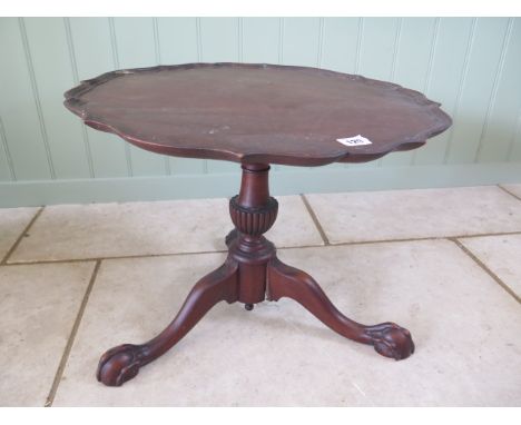 A mahogany coffee table on a tripod base, 39cm tall x 51cm wide 