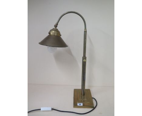 A brass adjustable desk lamp in working order 
