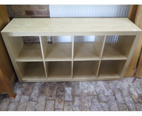A wood effect shelf unit, 79cm x 150cm x 39cm 