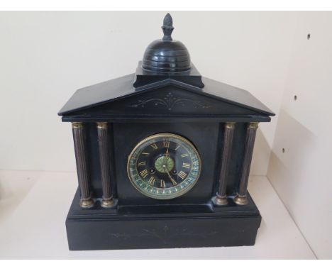 A Victorian black slate striking mantle clock in running order, chip to one corner otherwise generally good, 38cm tall x 33cm