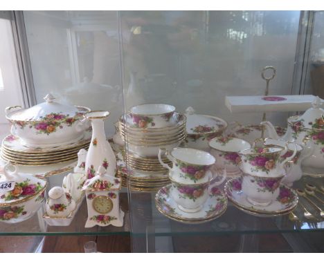 A large six setting Royal Albert Country Roses tea and dinner service including two tureens, meat plate, cake stand, sandwich