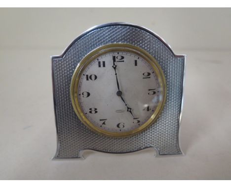A silver mounted travel clock, 8 x 8cm, not working, casing good 