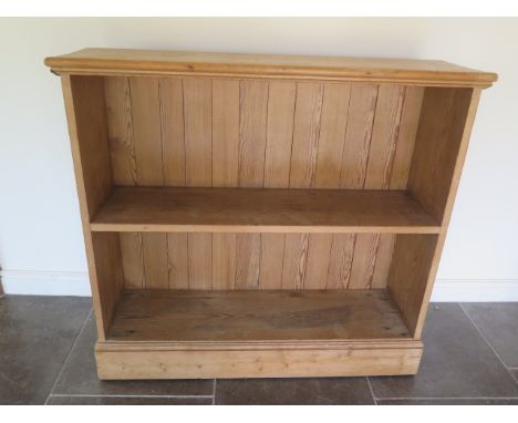 A Victorian stripped pine open fixed shelf bookcase, 119cm tall x 127cm x 37cm 