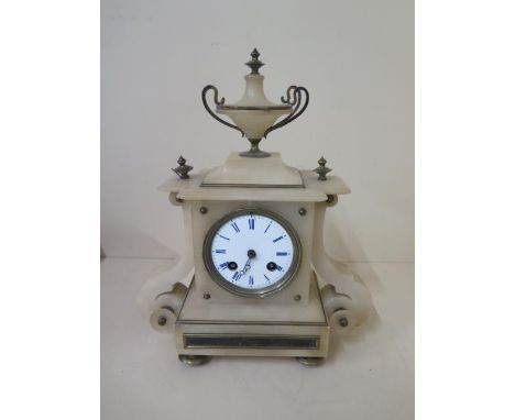 An alabaster striking mantle clock, 30cm tall, reasonably good condition, presented by the congregation of the Christian Unio