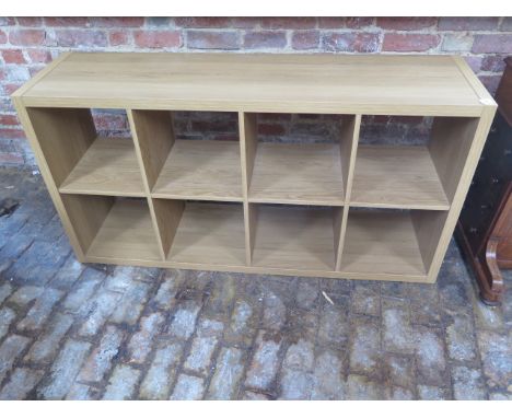 A wood effect shelf unit, 77cm x 147cm x 39cm 