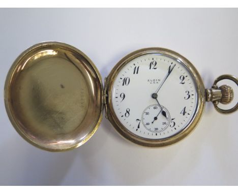 An Elgin full hunter pocket watch in original Dennison gold plated case, watch diameter 5cm, good working order and good cond