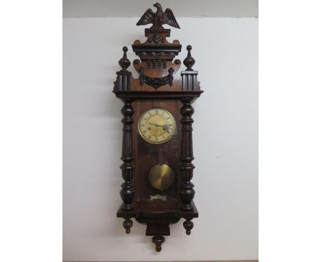 An Austrian 8 day striking wall clock, 94cm tall, in running order 