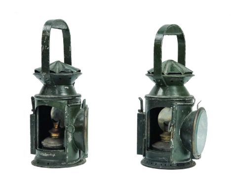 Railway handlamps - a complete pair Comprising two identical green handlamps each with adjustable bnurner, reflectors and red