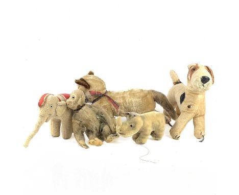 A collection of early to mid 20th century Steiff style, Chiltern etc soft toys  Comprising:An early mechanical tail operated 