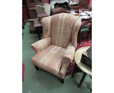 A wingback armchair, floral stripe upholstery, fire label to seat cushion 