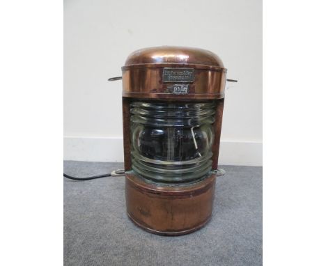 An early 20th Century copper ship's lamp with plaque marked I.H. Peters & Bey, Hamburg 9532 converted to electricity, 35cm ta
