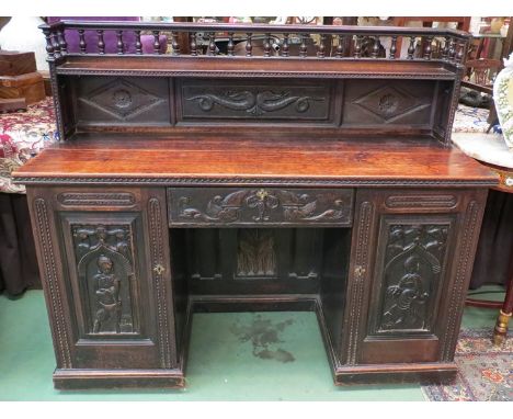 A 17th Century and later twin pedestal oak sideboard the raised spindle gallery and shelf over two single cupboards and centr