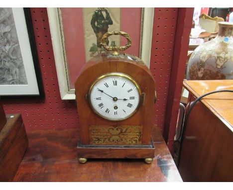 A Victorian mantel clock of domed form with ring drop handles, circular white enamel face a/f