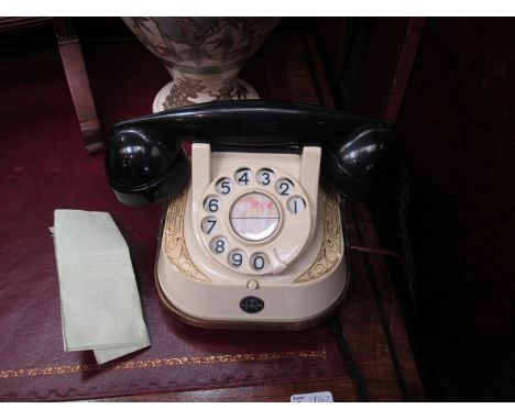 A vintage Belgian dial telephone with paperwork 