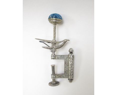 A 19th Century Hemmingbird white metal table sewing clamp with pin cushion