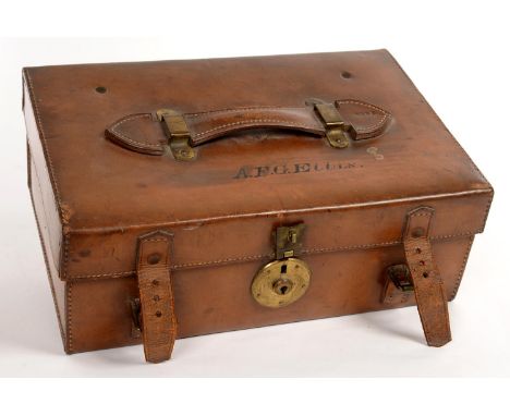 A CANVAS LINED TAN LEATHER CASE, THE LID INSCRIBED A F G ELLIS, HANDLE STAMPED 2391, 35CM L, TRADE LABEL OF J ANDREWS TRUNK B