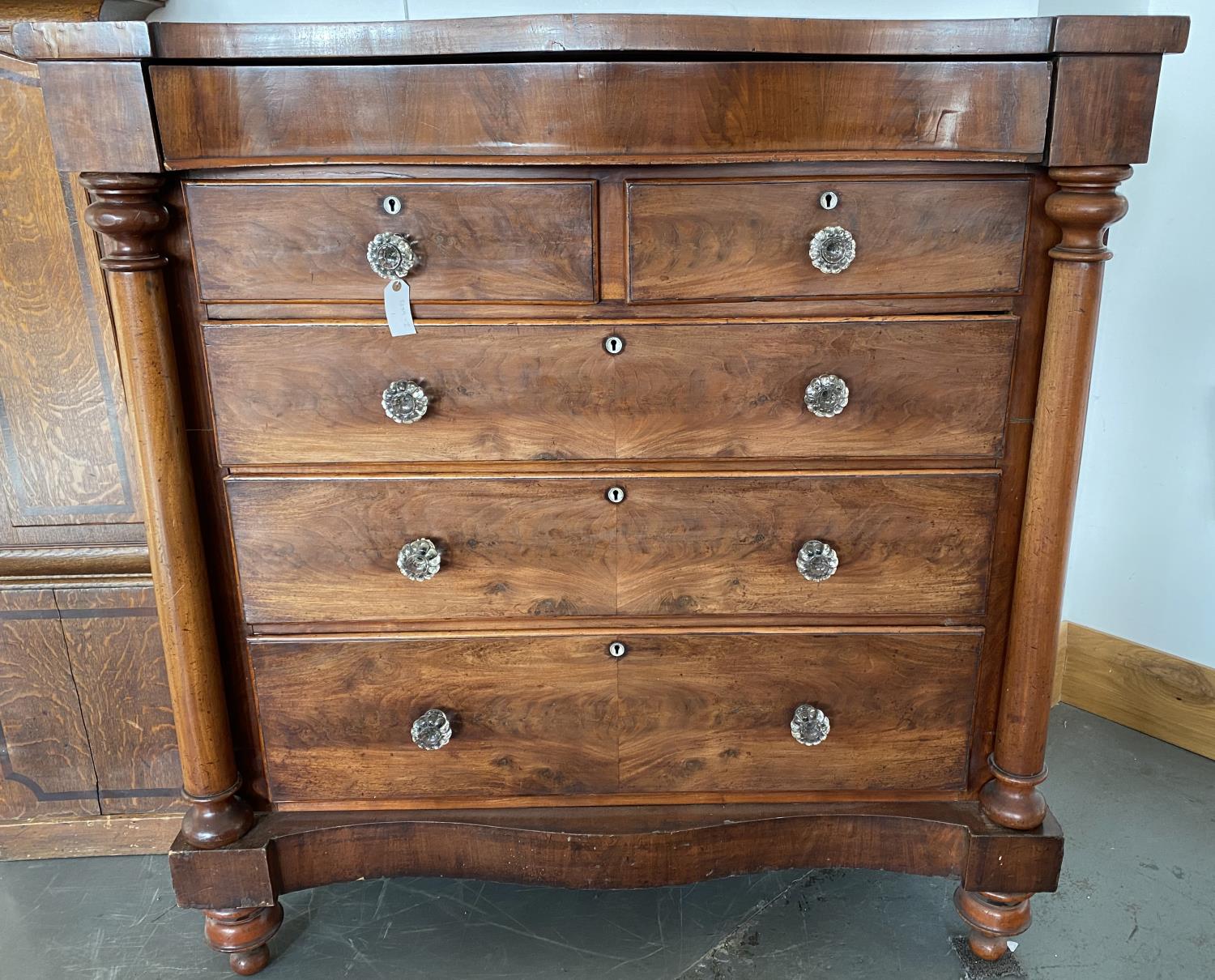 A VICTORIAN MAHOGANY CHEST OF DRAWERS, ON TURNED BUN FEET WITH LATER