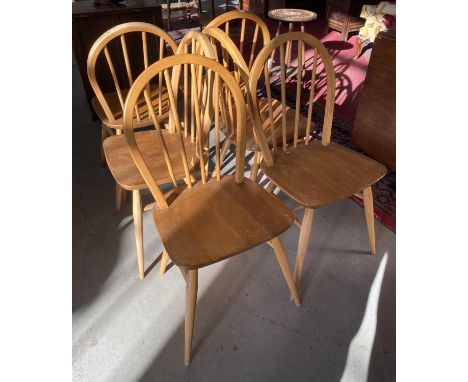 A SET OF SIX ERCOL ASH DINING CHAIRS  